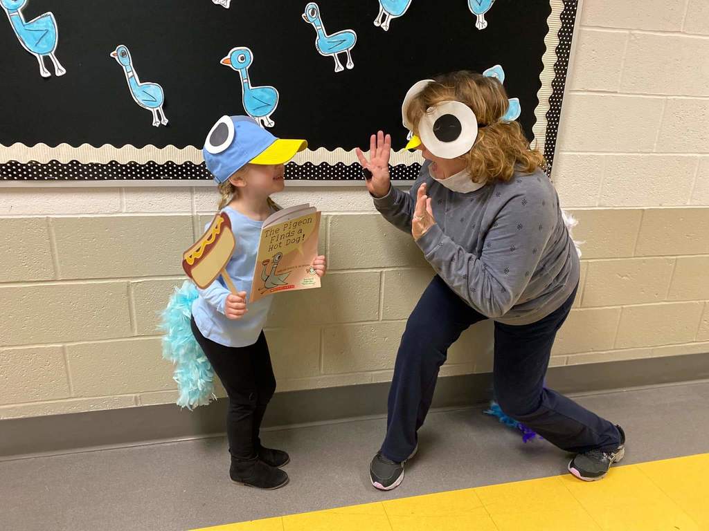 Image of student and teacher dressed like pigeons.