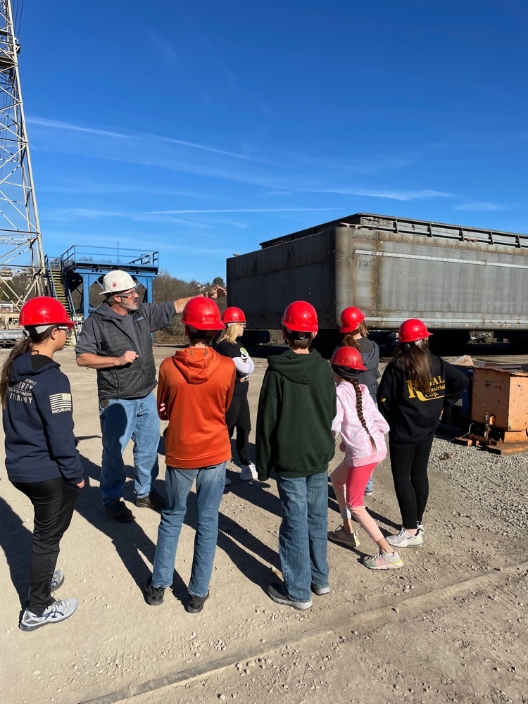 Students hear about how barges are welded together. 